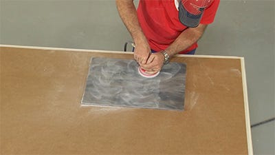 polishing solid surface with 30-micron pad to add a matte finish