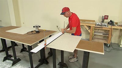 clamping down the solid surface before making the cut