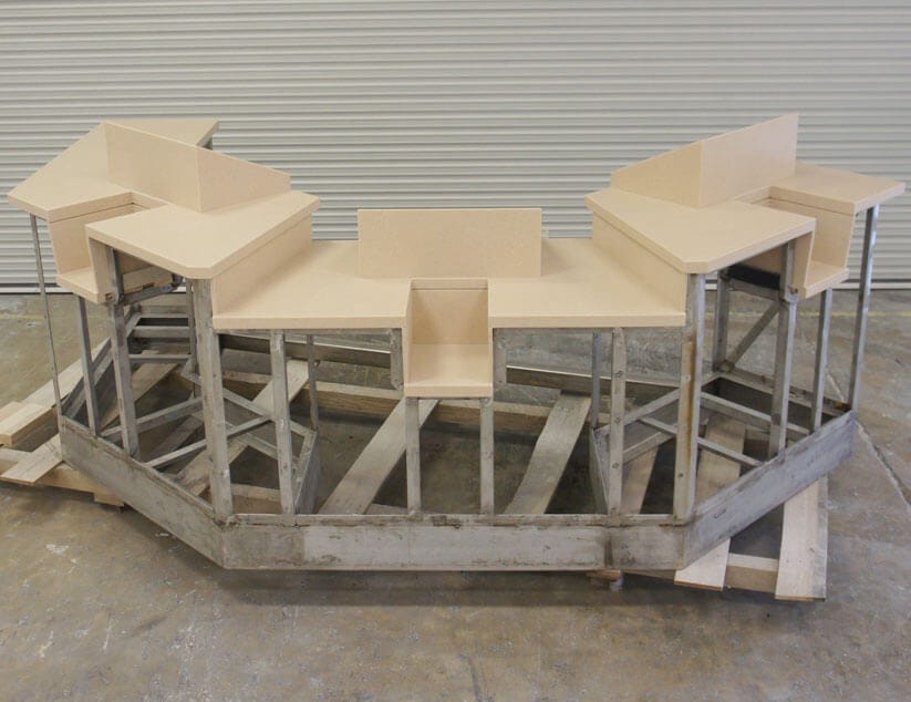 worn teak console door and rod holders on center console boat