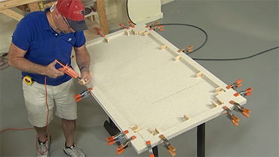 hot gluing the stop blocks to the material