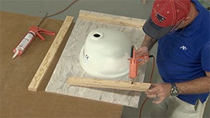 applying hot glue to the substrate