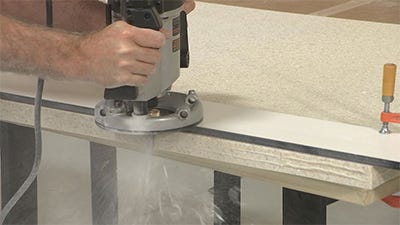 trimming the edges with a straight router bit