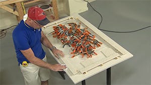 Wipe the material clean with denatured alcohol before applying adhesive